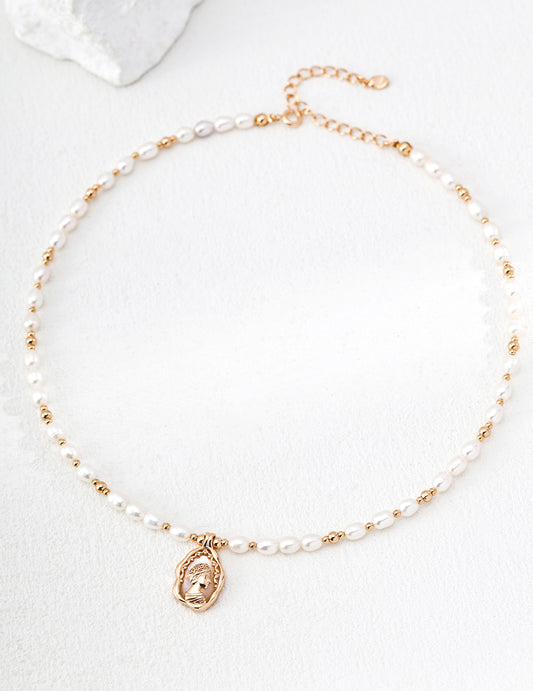 A high-contrast close-up of the Elara medallion, featuring the intricate Mother-of-Pearl inlay. This visual emphasizes the organic textures and the premium S925 sterling silver base, targeting customers looking for high-quality, artisan-crafted pearl jewelry with a nostalgic, vintage aesthetic.