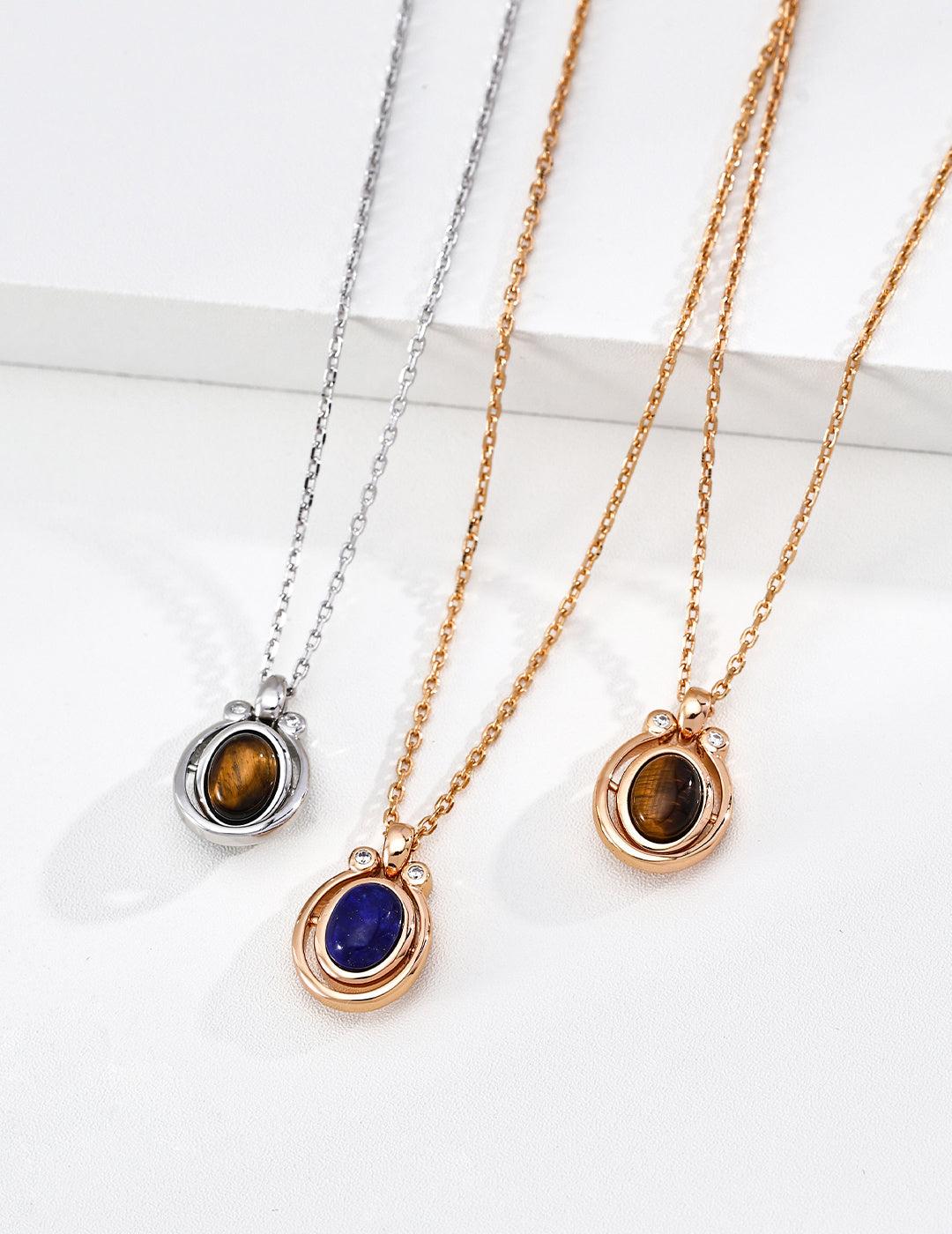 A curated flat lay featuring the Tiger’s Eye and Lapis Lazuli necklaces. This image showcases the vibrant blue and golden-brown textures of the natural stones, targeting searchers looking for meaningful gemstone jewelry and high-quality "luck-themed" luxury accessories for versatile daily wear.