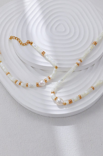 A focused view of the central freshwater pearl and the vintage gold hardware, highlighting the fine artisanal assembly and the rich, sun-kissed tone of the S925 silver.