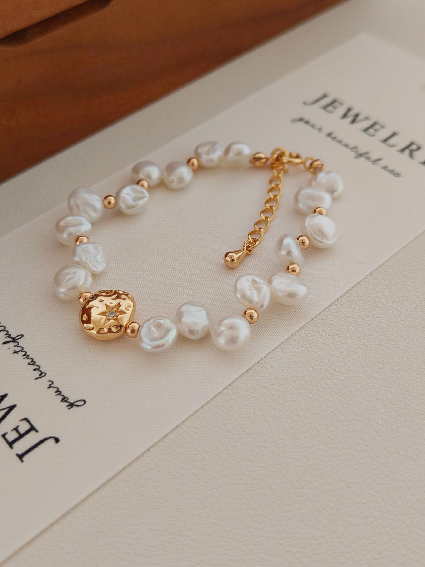 A close-up detail of the S925 sterling silver hallmark and the high-polish gold plating, emphasizing the premium material quality and durable craftsmanship.