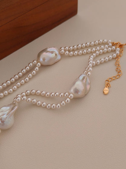 Close-up of the 18K gold vermeil 2.4-inch adjustable extender and hallmark clasp on the Selene pearl necklace.