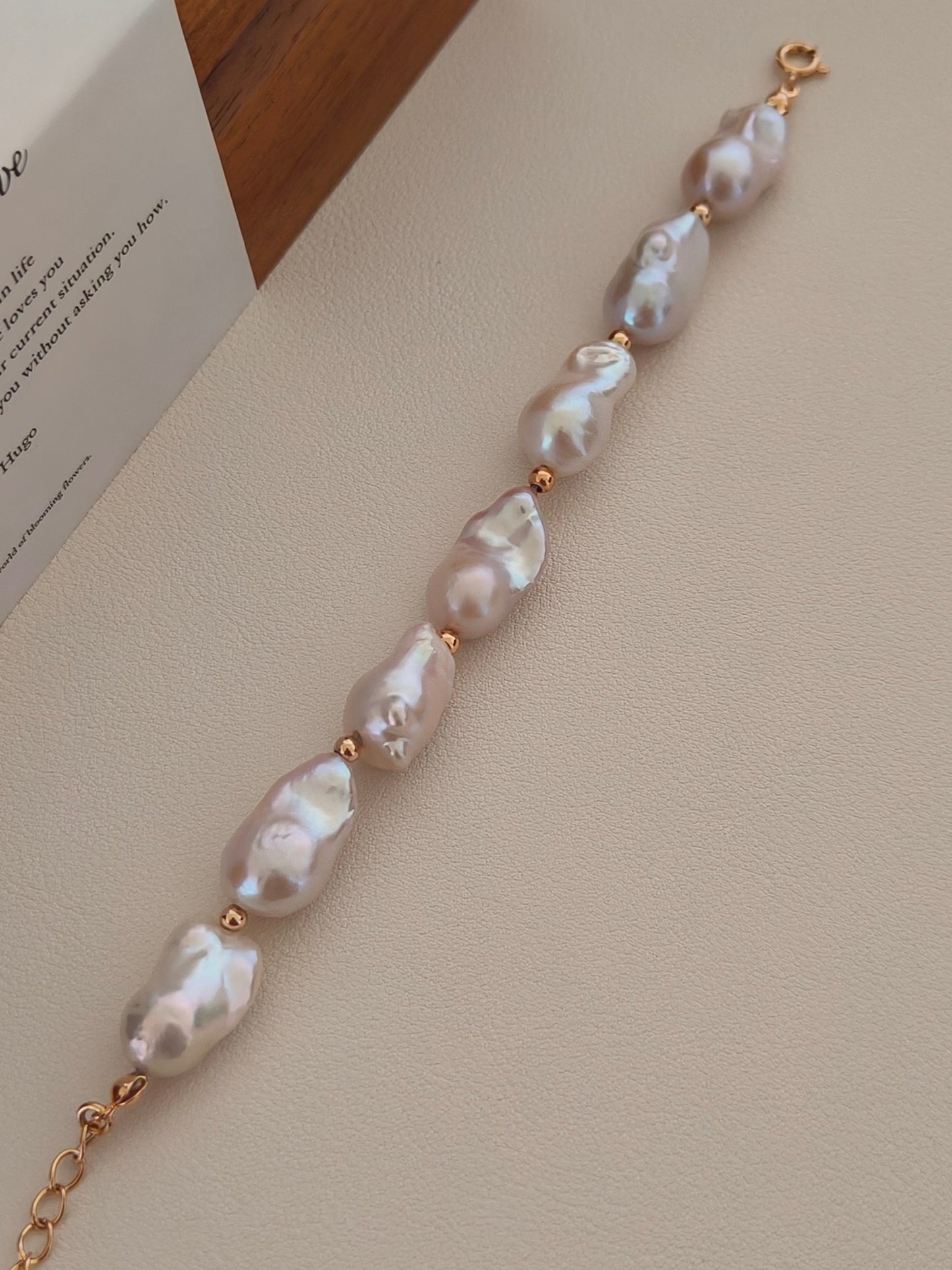 Vera Lustre "Luna" Baroque Pearl Bracelet displayed vertically, showcasing the substantial size and mesmerizing iridescent luster of each organic freshwater pearl against a clean background.