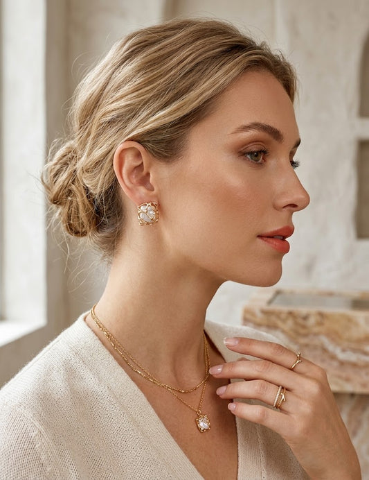 A lifestyle image of a woman wearing the Gaia woven pearl earrings, highlighting their architectural beauty and sophisticated "Quiet Luxury" appeal.