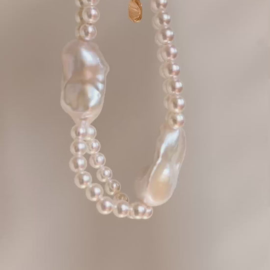 Detailed flat lay of the organic baroque pearls and seed pearls of the Isla bracelet, emphasizing the natural iridescence of each unique pearl.
