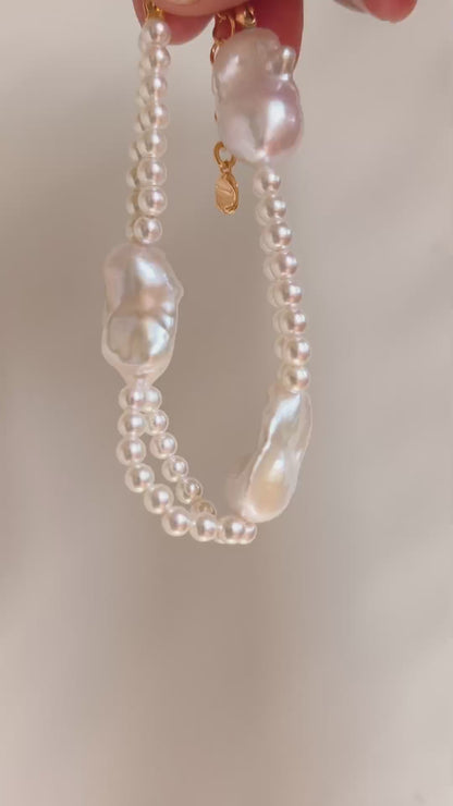 Detailed flat lay of the organic baroque pearls and seed pearls of the Isla bracelet, emphasizing the natural iridescence of each unique pearl.