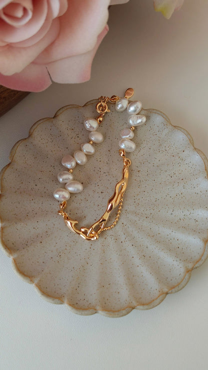An overhead view focusing on the adjustable extender chain and the branded clasp, demonstrating the custom fit for different wrist sizes.