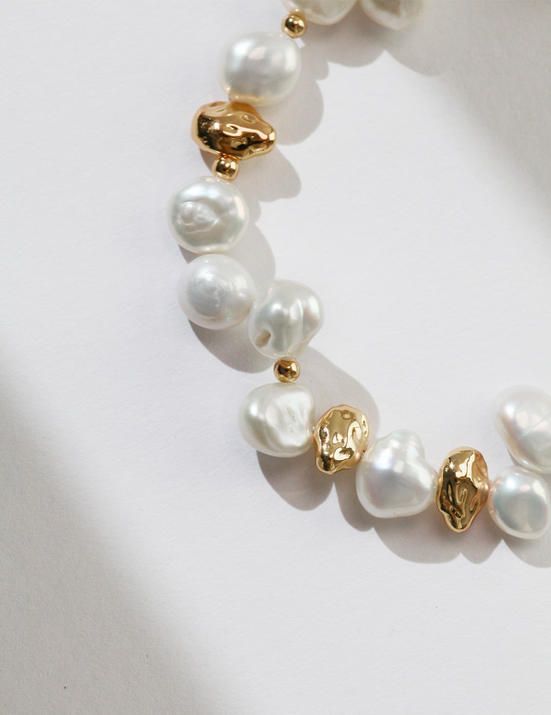 A focused view of the sculptural nugget links, highlighting the rich, matte vintage gold finish on the S925 sterling silver base. This visual reinforces the product's durability and artisanal craftsmanship, showcasing the refined, non-plated metallic glow and premium feel.