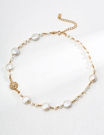 A high-resolution studio shot of the Cressida necklace, focusing on the 1.2x0.6cm pave-set centerpiece and the uniform 5mm pearls. This main visual emphasizes the premium S925 silver craftsmanship and the radiant vintage gold finish.