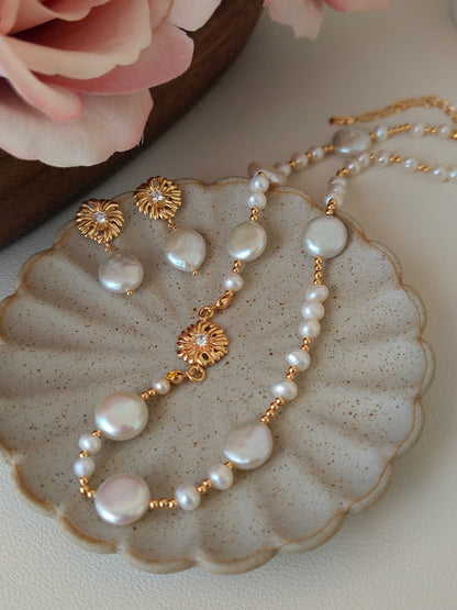 A detailed shot of the pave-baroque set displayed on a textured pedestal. This emphasizes the "modern heirloom" quality and the versatile, gold-tone aesthetic suitable for weddings, galas, or everyday luxury.