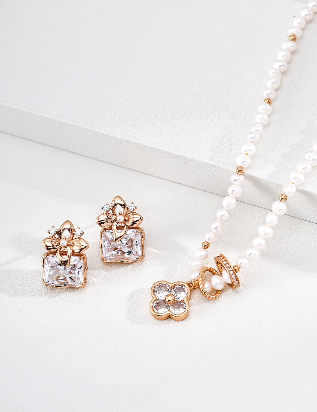 A curated display of the Fortuna clover set, featuring the matching necklace and coordinated pearl accessories. This visual highlights a cohesive lucky jewelry gift set, perfect for birthdays or symbolic celebrations.