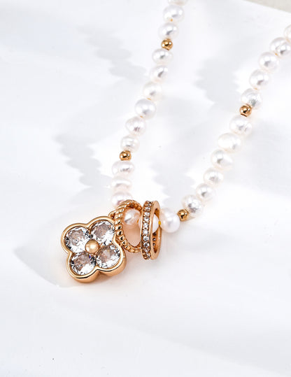 A macro close-up of the four-leaf clover charm, revealing the intricate setting of the cubic zirconia stones. This visual targets customers looking for symbolic jewelry with high-end, artisan-level detailing.