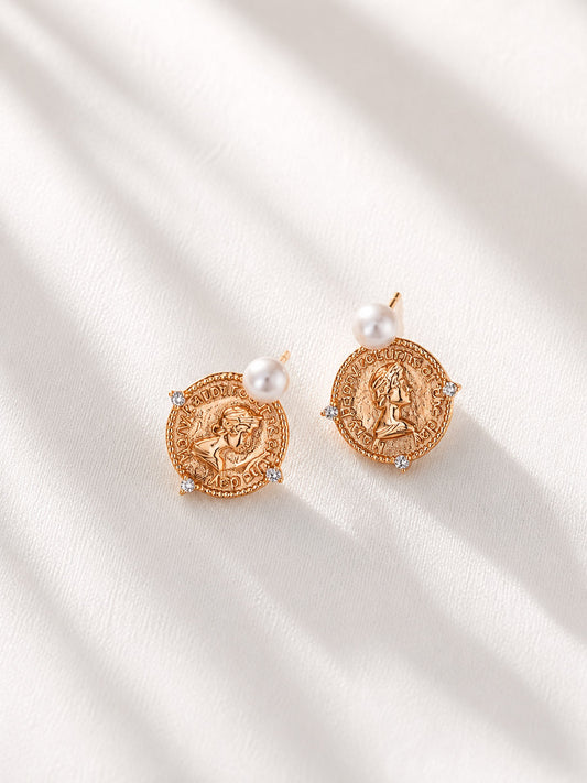 A clean studio shot of the Aurelia earrings, showcasing the intricate details of the coin motif and the creamy luster of the freshwater pearl drops. This image emphasizes the premium 18K gold S925 silver quality.
