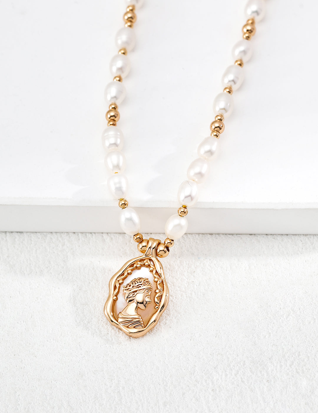 A high-contrast close-up of the Elara medallion, featuring the intricate Mother-of-Pearl inlay. This visual emphasizes the organic textures and the premium S925 sterling silver base, targeting customers looking for high-quality, artisan-crafted pearl jewelry with a nostalgic, vintage aesthetic.