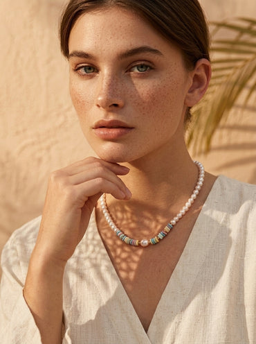 Model wearing the 15-inch Vera Lustre Ondine double-strand baroque pearl necklace in 18K gold vermeil for a luxury Mediterranean look.