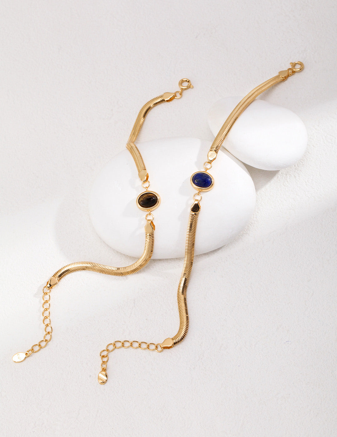 An overhead view of the bracelet fully unrolled, illustrating the high-quality S925 silver chain and the precision-cut oval gemstone settings.