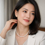 VÉRA LUSTRE "A Quietly Complete Pearl Wardrobe" featuring a modern woman wearing a classic freshwater pearl necklace and stud earrings.