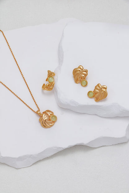 A curated flat lay of the Odile collection set, featuring the ring and coordinating accessories for a complete, avant-garde floral ensemble.