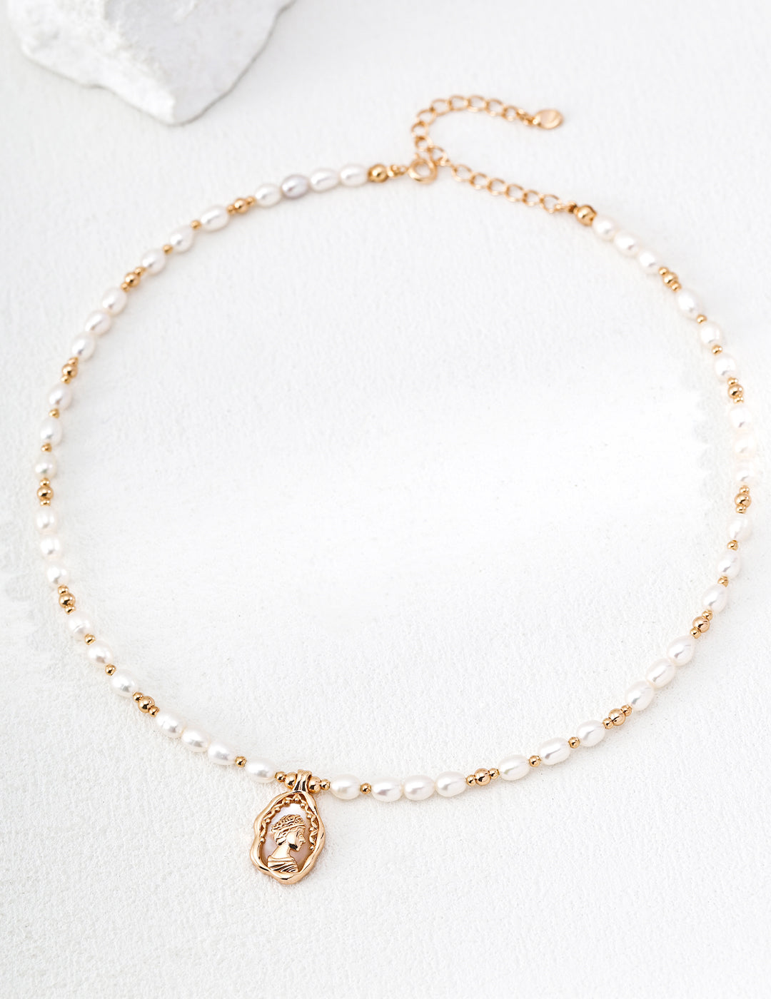 A high-contrast close-up of the Elara medallion, featuring the intricate Mother-of-Pearl inlay. This visual emphasizes the organic textures and the premium S925 sterling silver base, targeting customers looking for high-quality, artisan-crafted pearl jewelry with a nostalgic, vintage aesthetic.