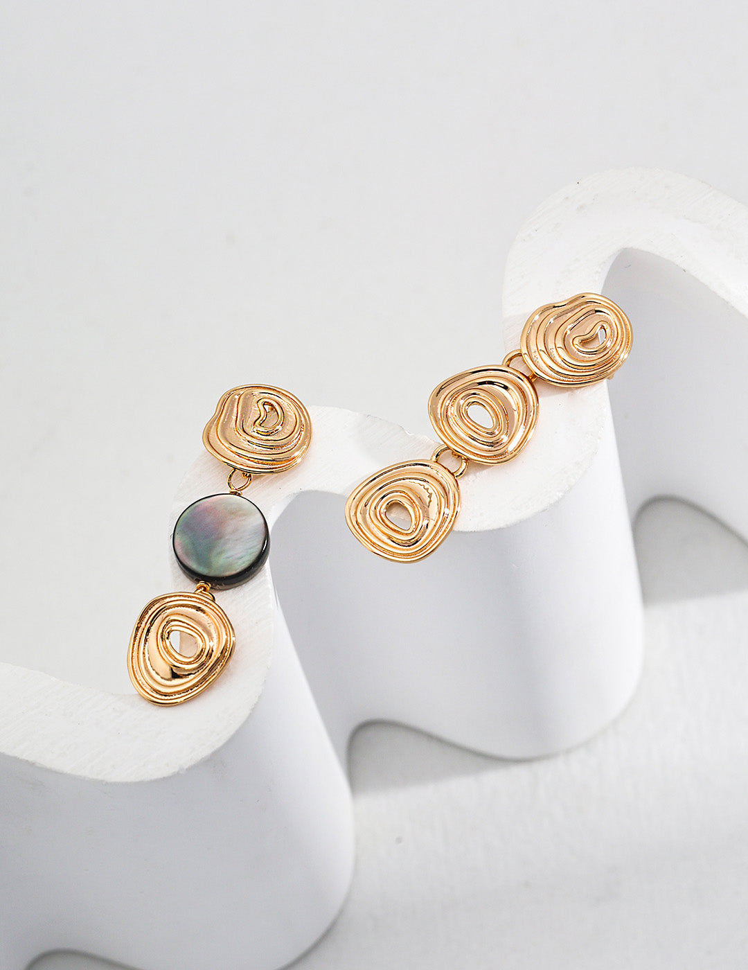 A clean studio shot of the Nyx earrings, showcasing the vertical Black Mother-of-Pearl inlay and the precision-crafted S925 silver geometric frame.