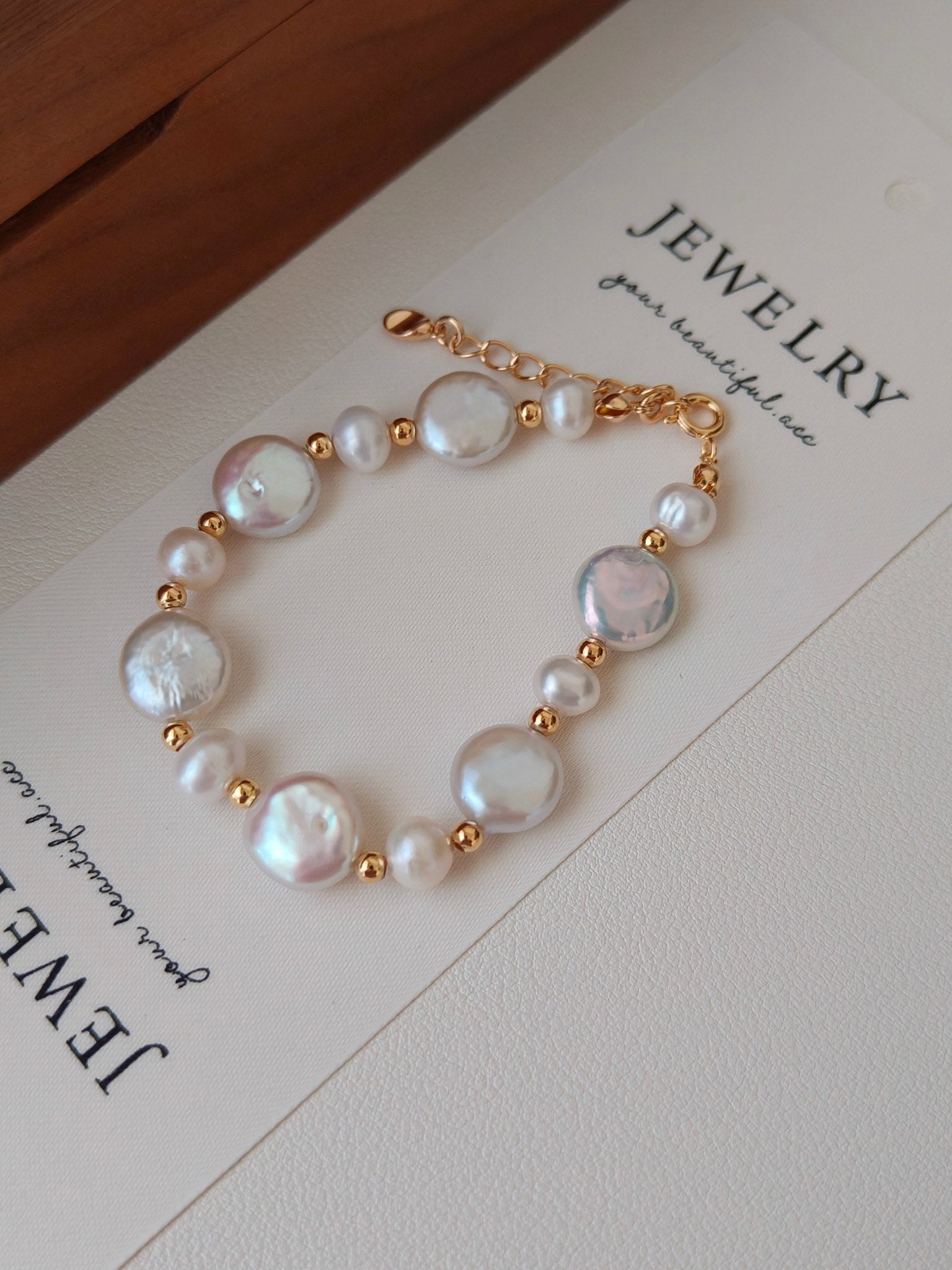 A detailed close-up focusing on the sculptural metal textures and the authentic, non-uniform surface of the natural pearls, emphasizing the handcrafted S925 silver quality.