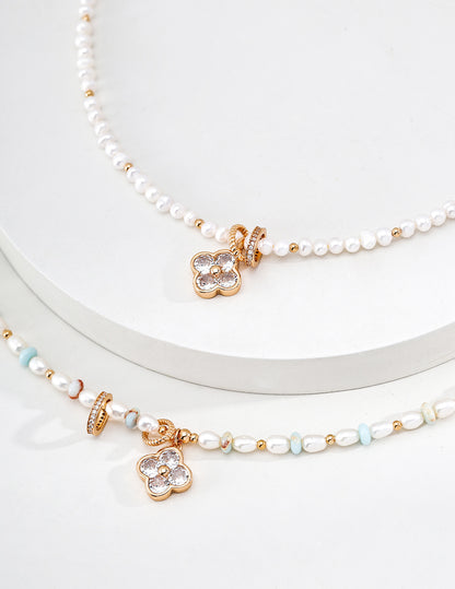 A focused view of the natural freshwater pearls and the secure vintage gold hardware. This reinforces the "organic luxury" feel and the brand's commitment to hypoallergenic, premium materials.