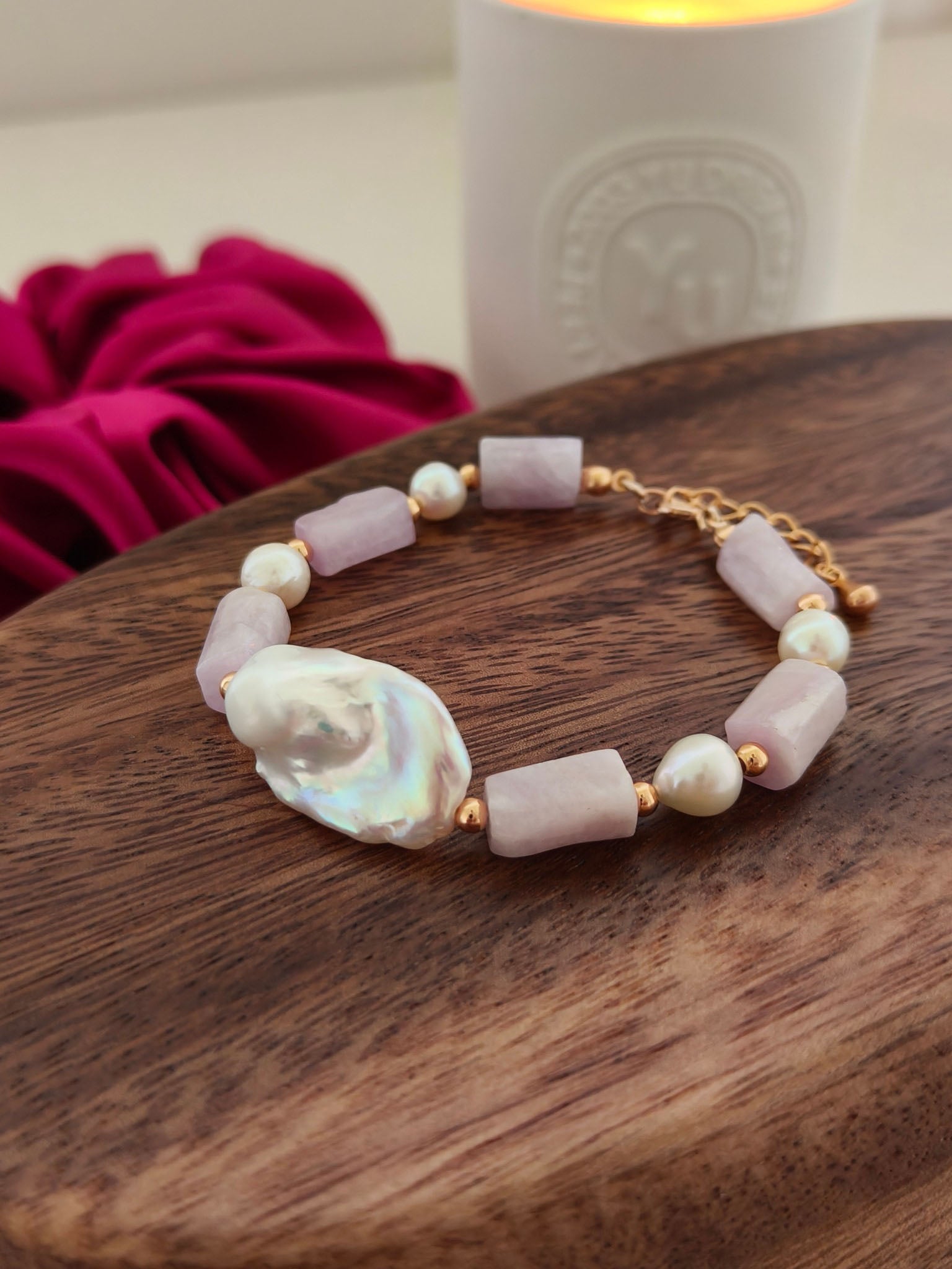 An overhead view of the bracelet laid flat, demonstrating the high-polish 18K gold finish and the elegant rhythm of the pastel-toned palette.