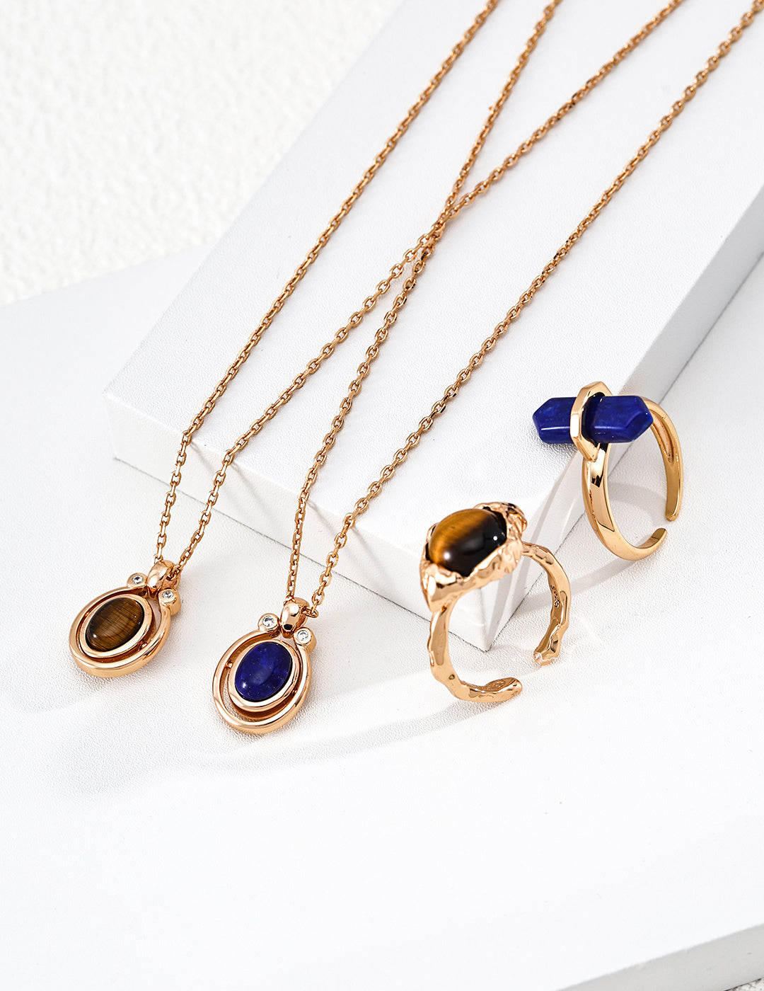 A curated display of the Lapis Lazuli and Tiger's Eye versions side-by-side. This visual highlights the rich color palette of the natural gemstones and the dual-metal options, targeting searchers looking for meaningful gemstone jewelry and high-quality "fortune" themed luxury accessories.