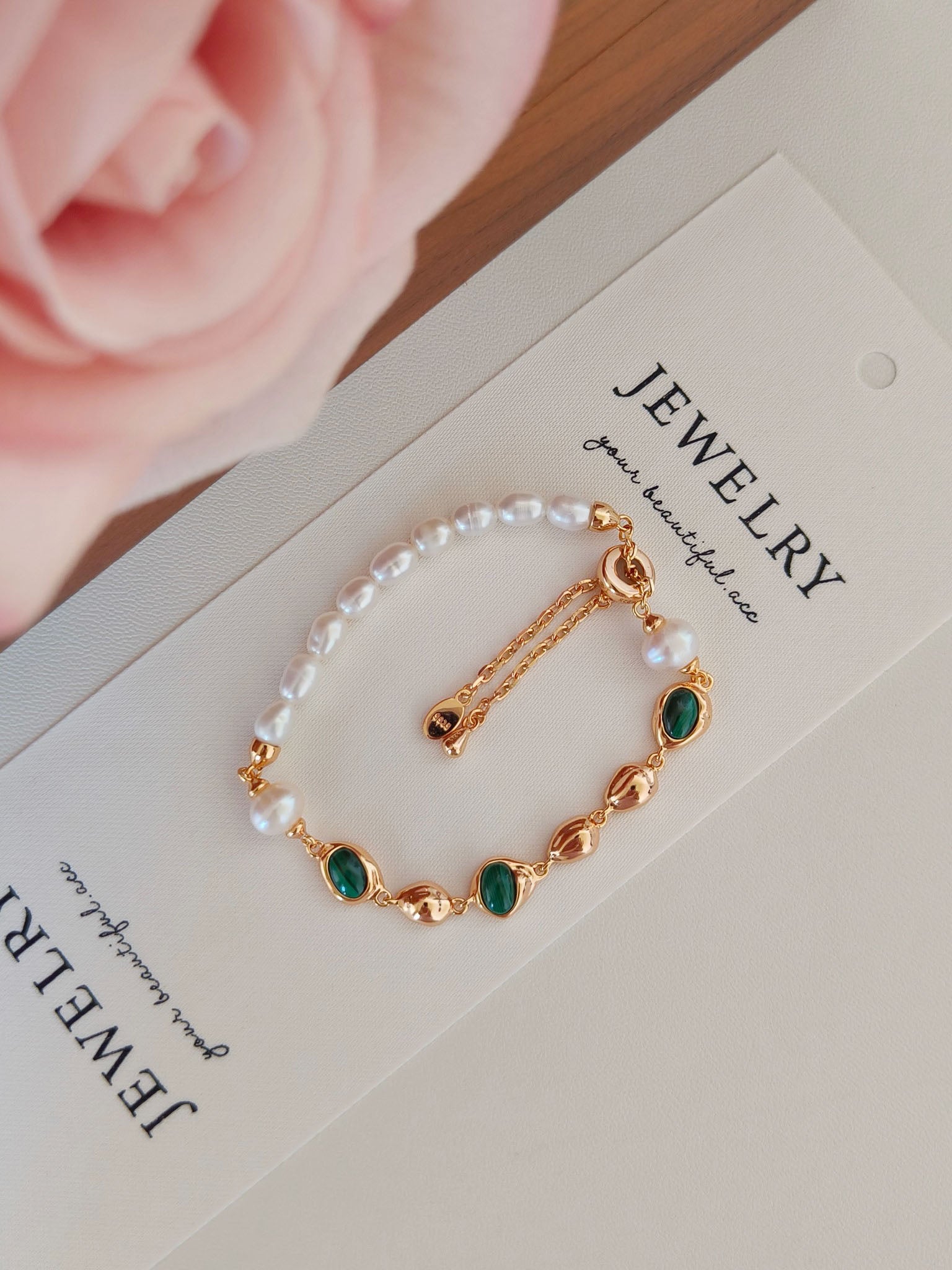 A macro close-up focusing on the Malachite and Pearl duo, emphasizing the secure bezel setting and the authentic quality of the S925 sterling silver craftsmanship.