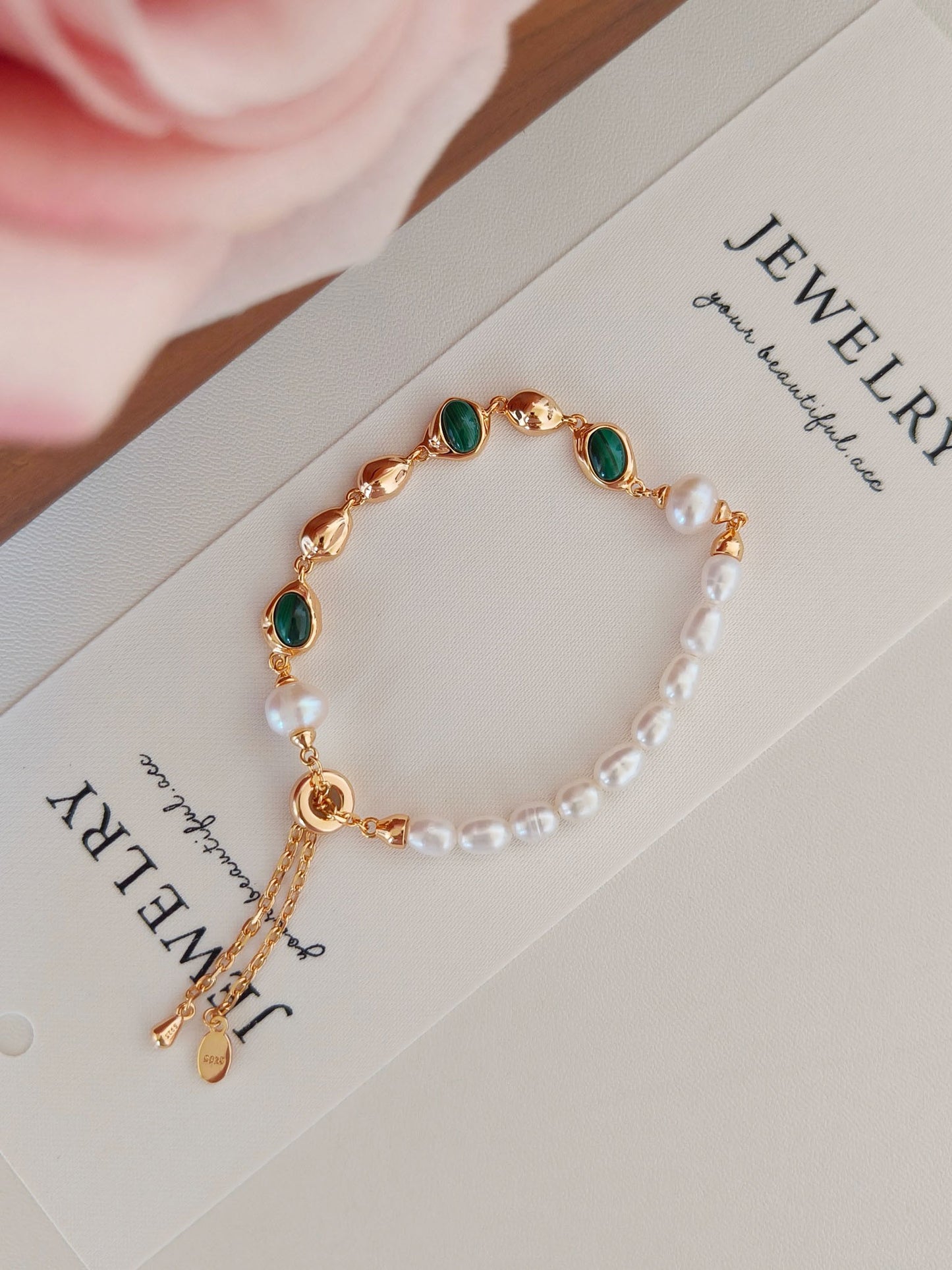 A side view of the bracelet laid flat, demonstrating the adjustable toggle/clasp and the elegant, minimalist silhouette of this healing stone jewelry piece.