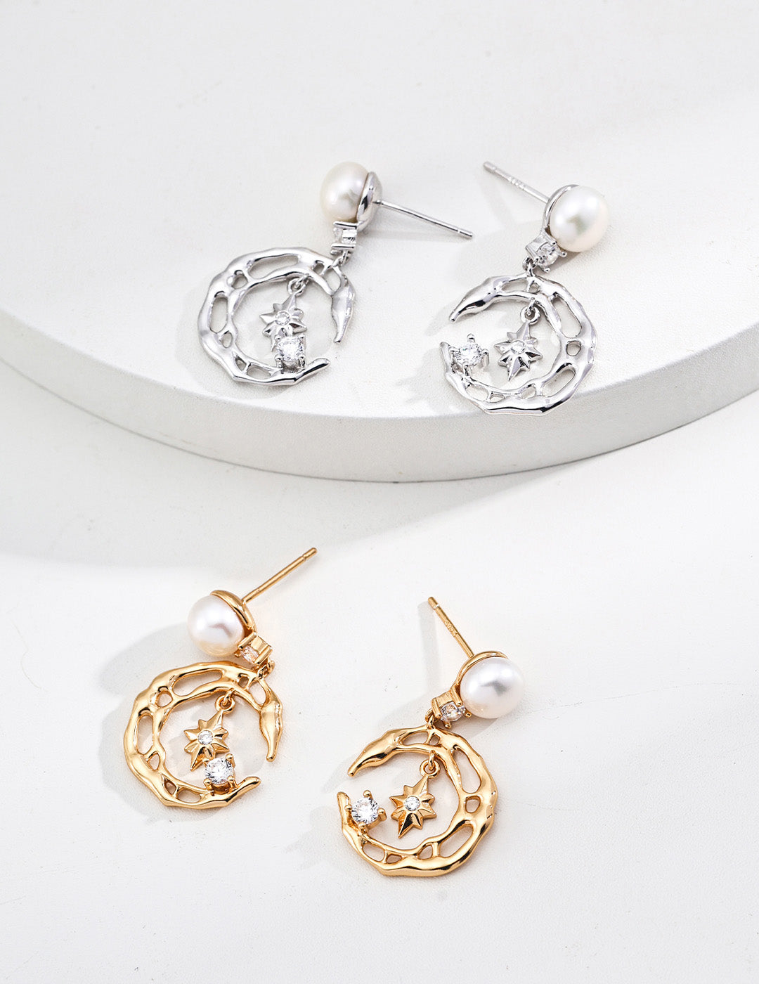 A side-by-side comparison of the Astra earrings in both Vintage Gold and Platinum Silver finishes, showcasing the premium S925 sterling silver craftsmanship.