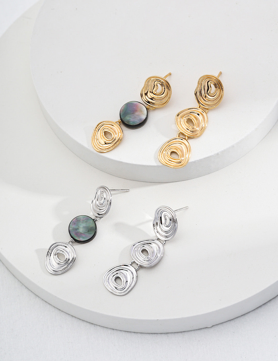 A macro detail shot of the vintage gold and silver options, highlighting the fine textures and the secure integrated hook design.