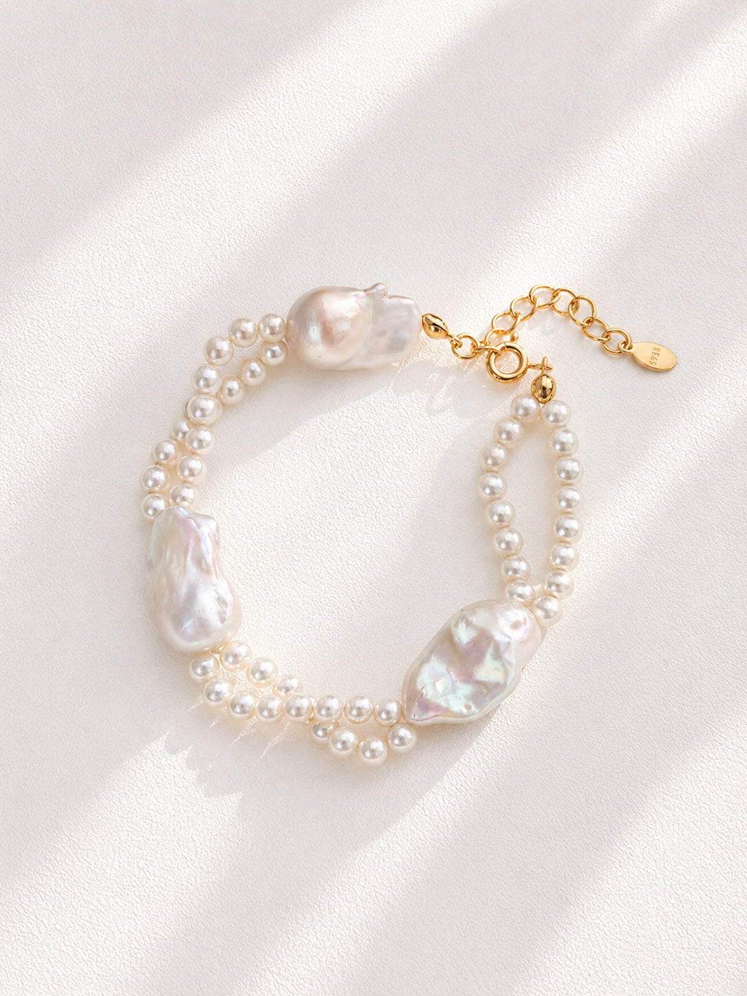 Vera Lustre | The "Isla" Dual-Layer Baroque & Seed Pearl Bracelet handcrafted with 18K Gold Vermeil and natural high-luster freshwater pearls on a clean white background.