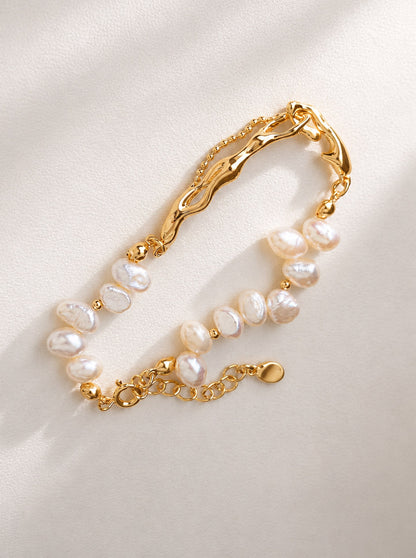 A high-definition studio shot of the Astraea bracelet, highlighting the consistent luster and creamy white hues of the natural freshwater pearls.