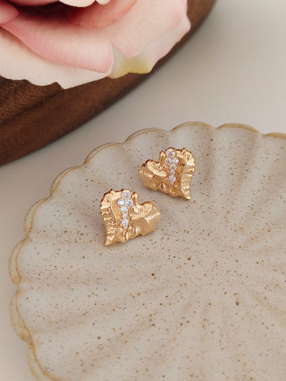 A secondary product angle focusing on the 3D sculptural depth of the hearts, targeting customers looking for unique, artisanal heart jewelry.