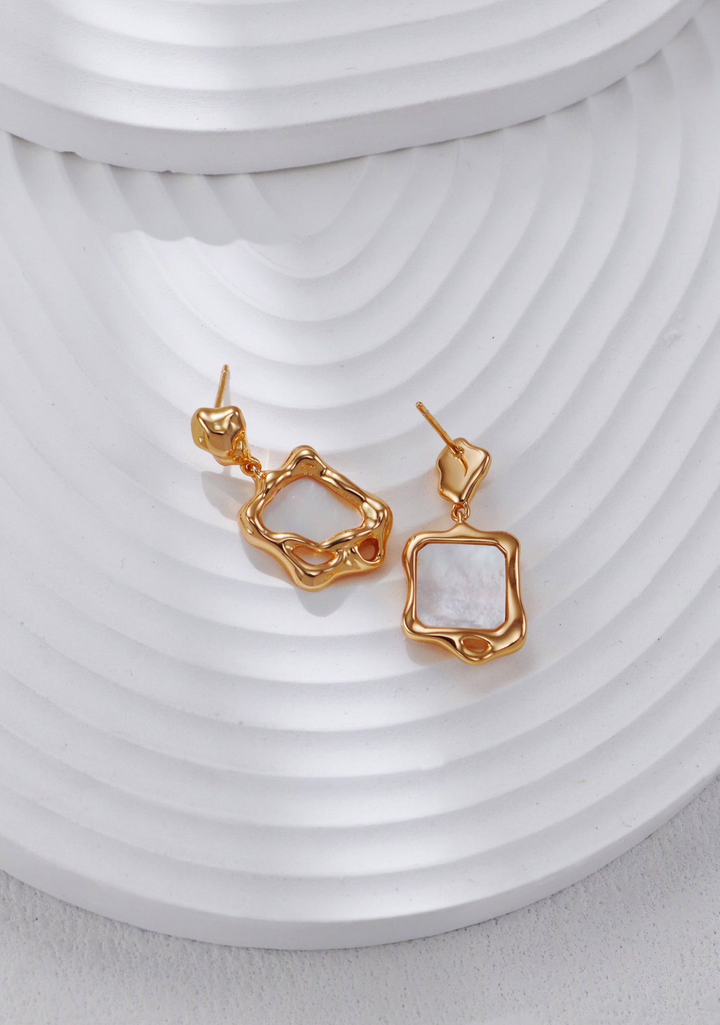 A secondary product angle focusing on the unique, asymmetrical "molten" texture of the metal, targeting searchers looking for sculptural statement jewelry.