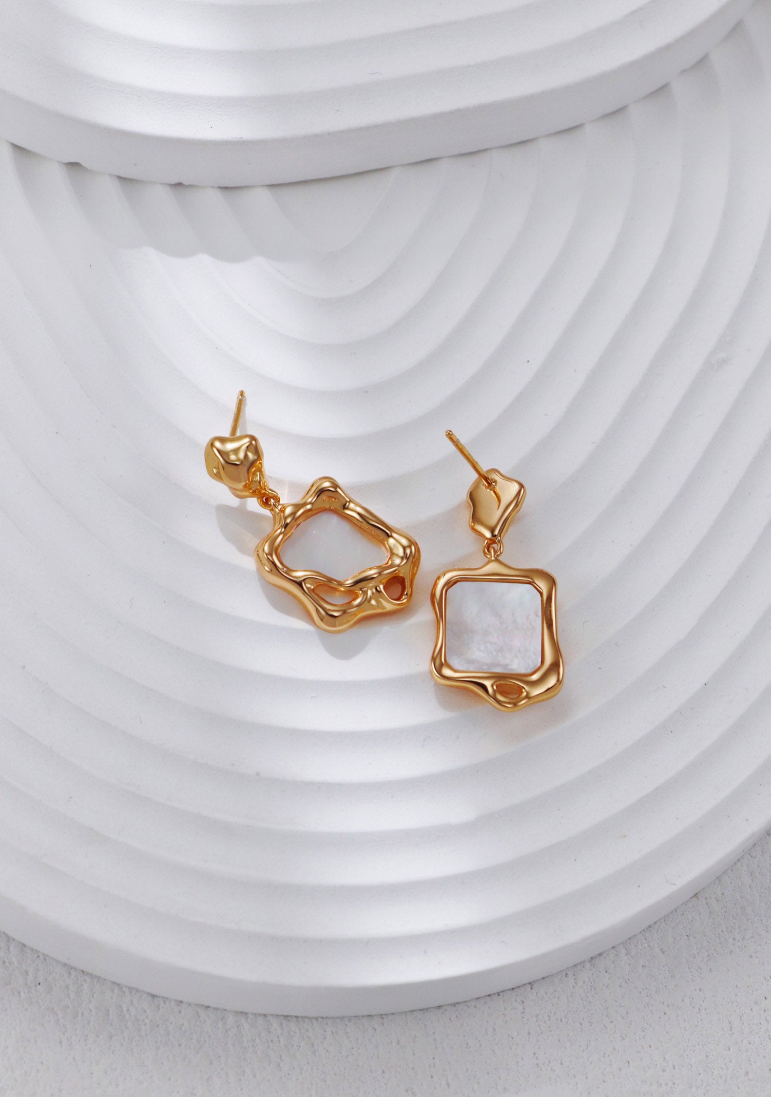 A secondary product angle focusing on the unique, asymmetrical "molten" texture of the metal, targeting searchers looking for sculptural statement jewelry.