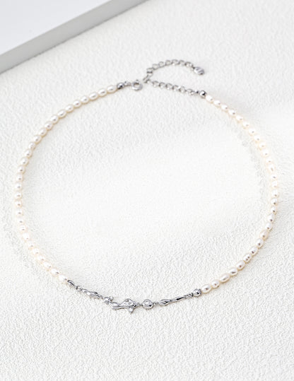 A clean product shot of the Astra necklace in platinum white gold tone. This view emphasizes the cool, modern brilliance of the silver and the high-luster pearls, targeting customers looking for celestial-themed silver jewelry.