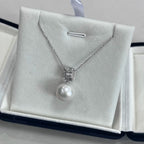 rchitectural square geometric pendant design in S925 sterling silver, holding a large Edison pearl.