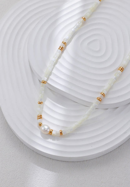 A secondary product angle focusing on the luster of the 4*5mm freshwater pearl centerpiece and the delicate golden spacers, targeting customers looking for bohemian-luxe bridal or vacation jewelry.