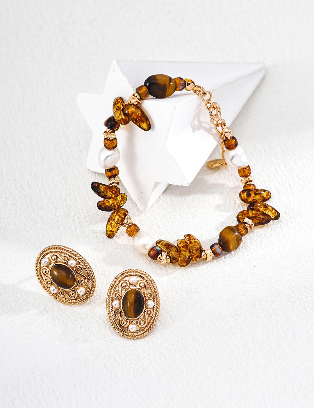 A flat lay of the Cybele bracelet paired with its matching necklace, showing a complete bohemian energy jewelry set perfect for layered styling.