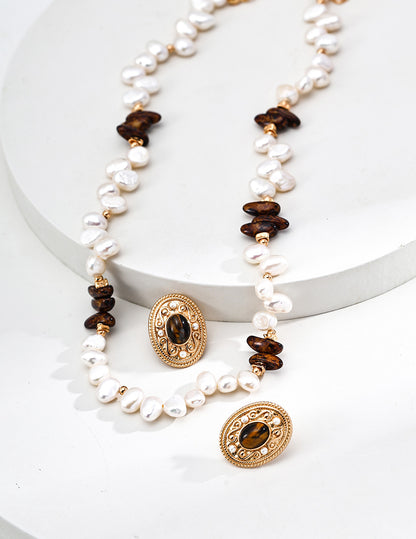 A curated flat lay featuring the Cyra necklace and matching bracelet. This visual emphasizes the cohesive design language of the set, encouraging coordinated jewelry set purchases for those seeking a complete aura of protection.