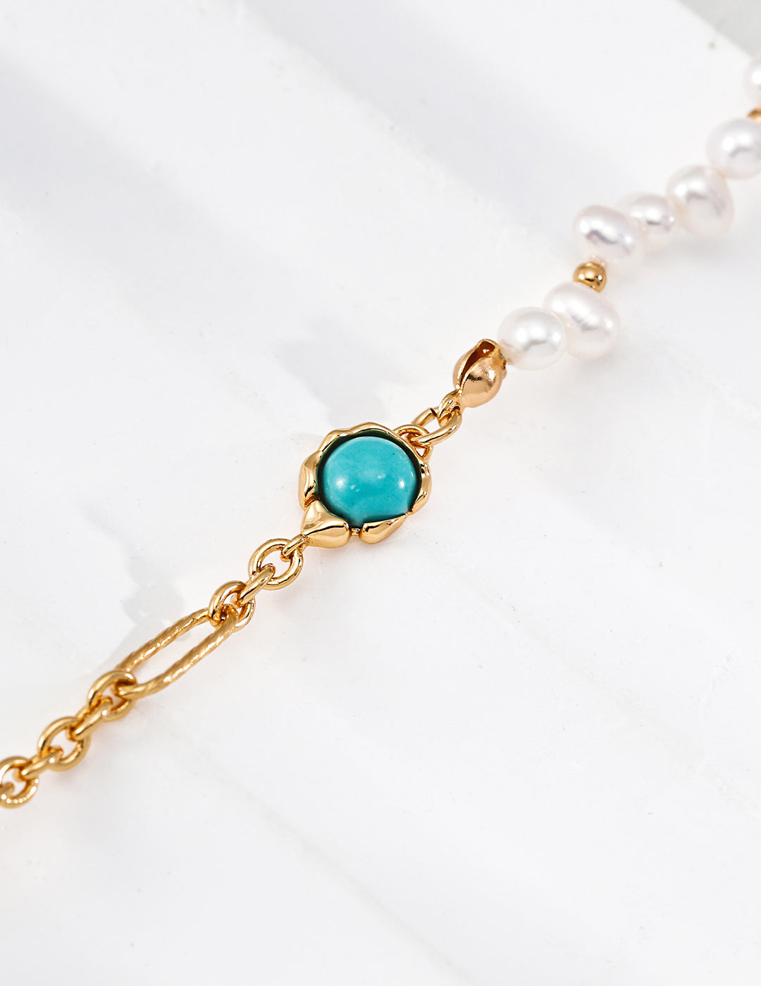 A close-up detail of the S925 vintage gold hardware, showcasing the high-quality craftsmanship and the classic multi-bead stringing technique.