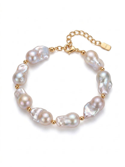 Vera Lustre "Luna" Bracelet featuring large, organic baroque pearls on a 925 sterling silver chain plated in 18K gold.